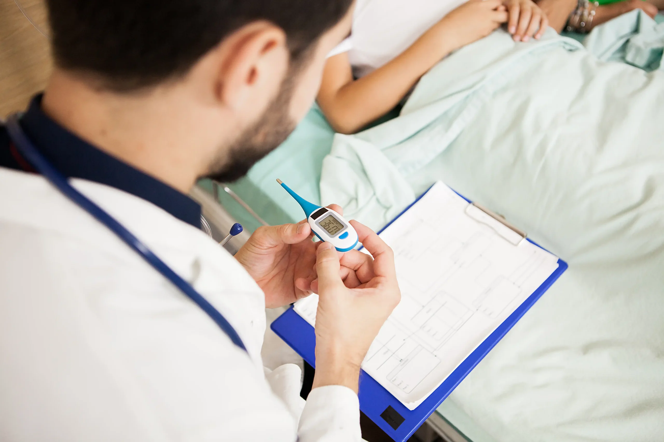 doctor-taking-body-temperature-her-patient-hospital-room